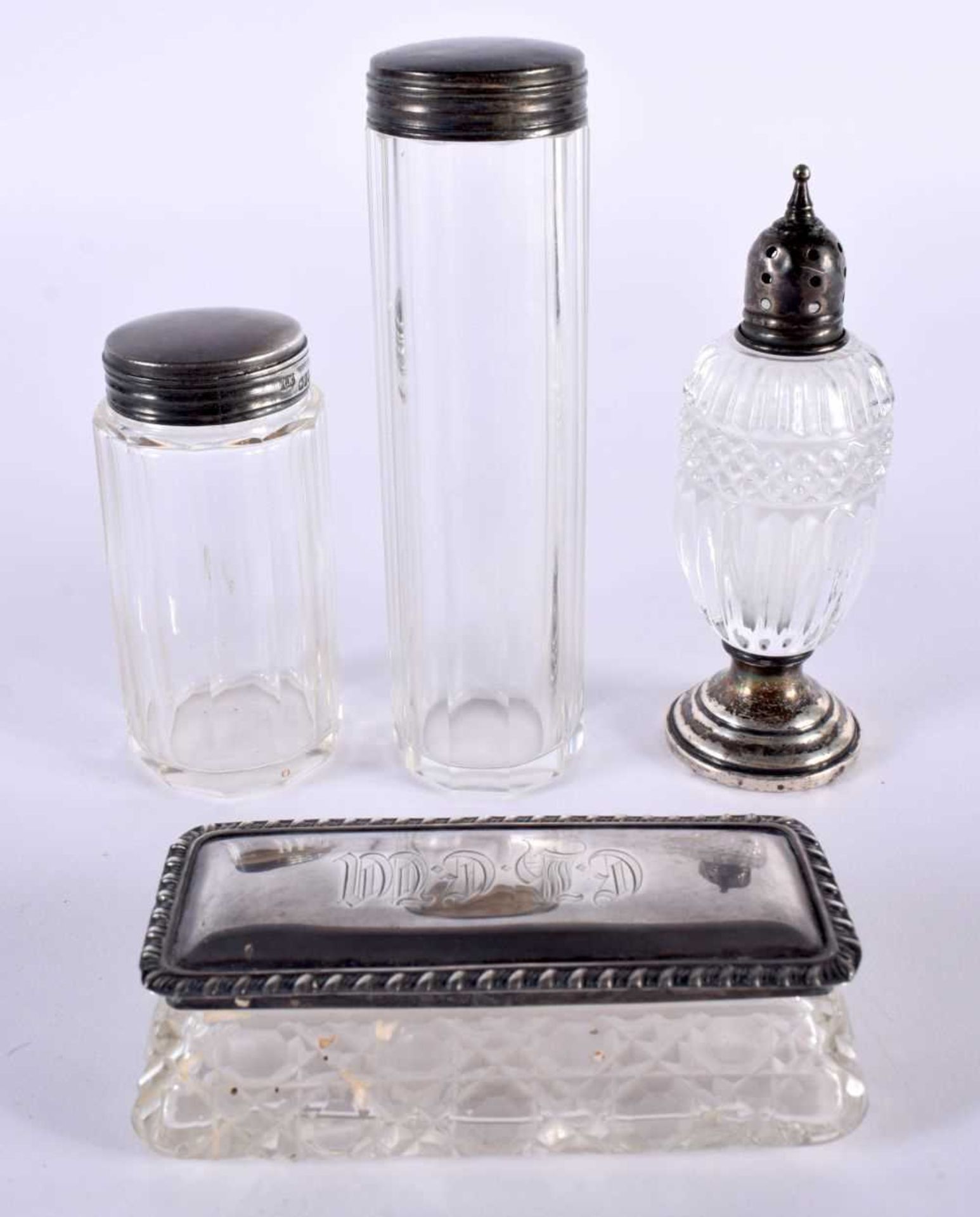 FOUR SILVER TOPPED DRESSING TABLE JARS. Largest 12.8 cm x 3.3cm (4)