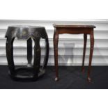 A Black lacquered stool with a mother of Pearl inlaid top together with a leather topped side table.