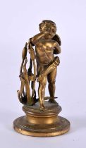 A SMALL 19TH CENTURY FRENCH BRONZE FIGURE OF A YOUNG BOY modelled amongst foliage. 66.6 grams. 7.