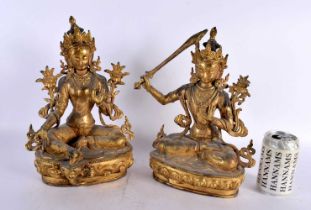 A LARGE PAIR OF 19TH CENTURY CHINESE TIBETAN GILT BRONZE FIGURES OF BUDDHAS Qing, modelled upon