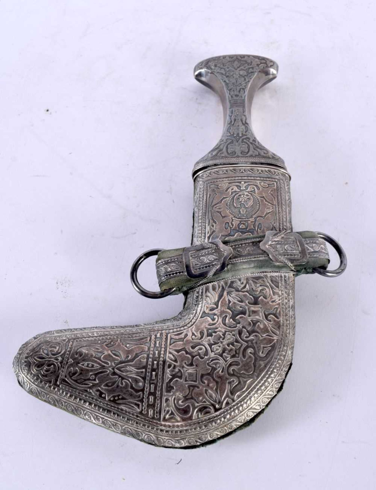 AN OMANI MIDDLE EASTERN WHITE METAL JAMBIYA DAGGER. 27 cm x 16 cm.