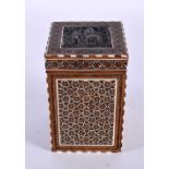A 19TH CENTURY MIDDLE EASTERN SILVER INLAID MICRO MOSAIC TEA CADDY AND COVER decorated with figures.
