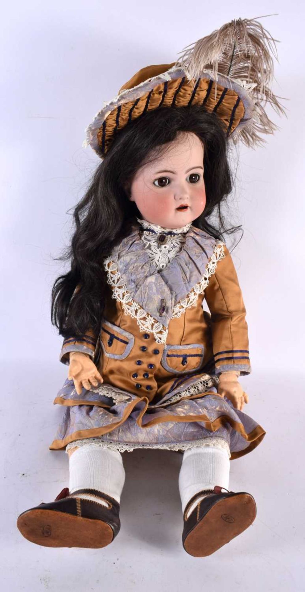 A FINE SIMON HALBIG BISQUE HEADED PORCELAIN DOLL wearing original mustard clothing. 65 cm long.