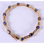 A SILVER GILT BRACELET SET WITH SAPPHIRES AND CZ. Stamped 925, length 18.5cm, weight 11g