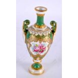 A FINE ANTIQUE ROYAL WORCESTER TWIN HANDLED PORCELAIN VASE by E Phillips, painted with roses upon an