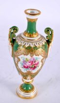 A FINE ANTIQUE ROYAL WORCESTER TWIN HANDLED PORCELAIN VASE by E Phillips, painted with roses upon an