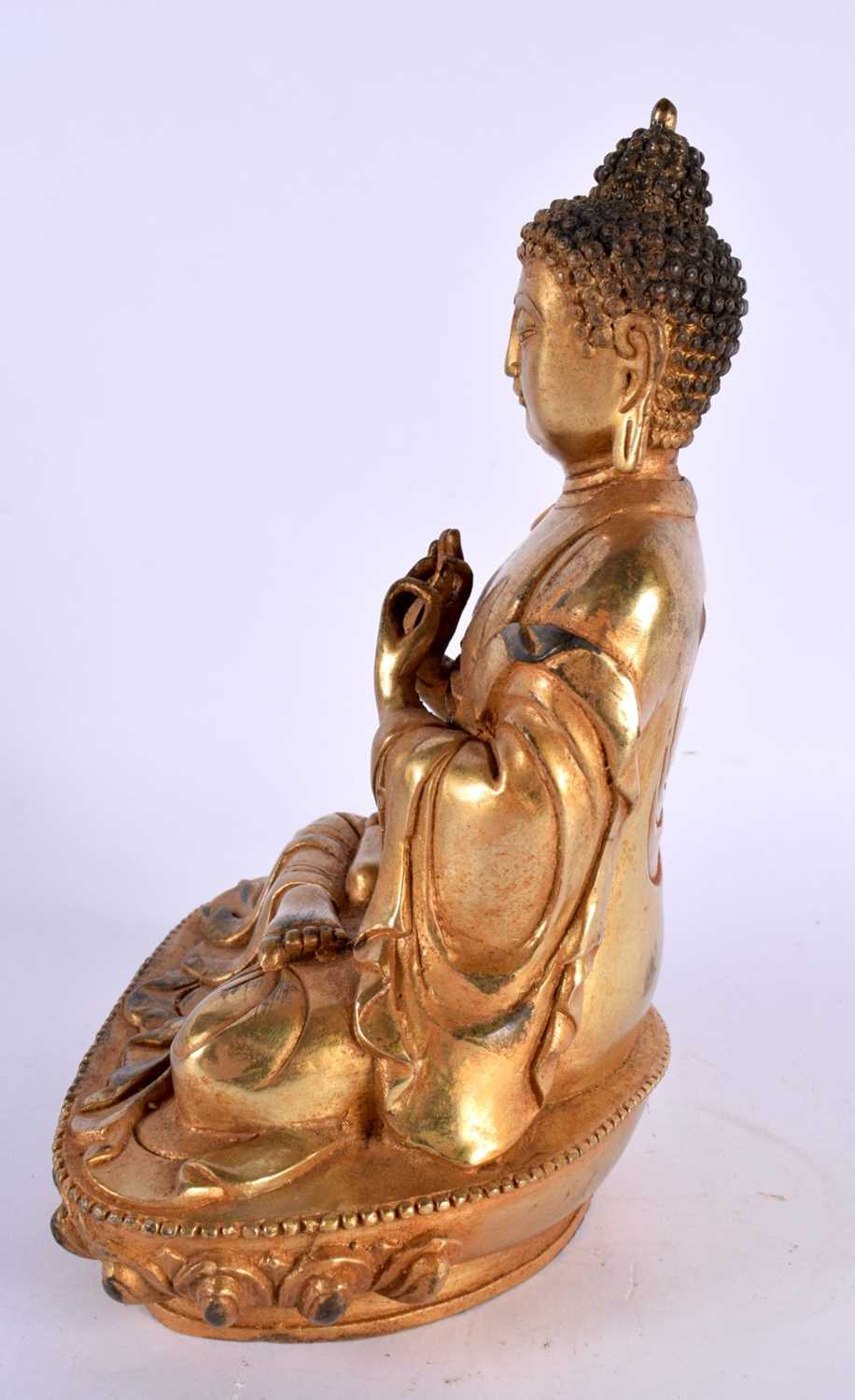 A CHINESE TIBETAN GILT BRONZE FIGURE OF A BUDDHA 20th Century. 22cm x 12 cm. - Image 2 of 5