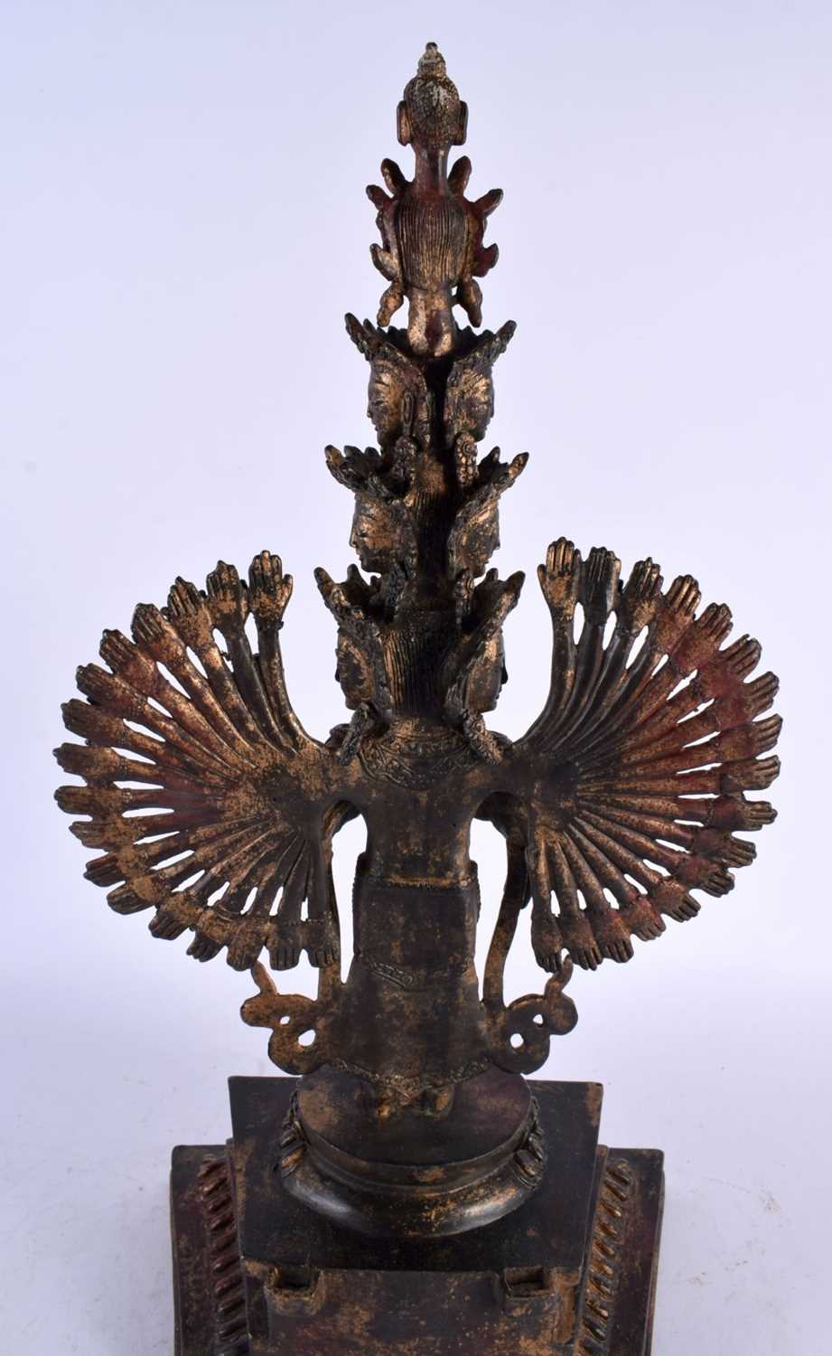 A LARGE CHINESE LACQUERED SINO TIBETAN BRONZE FIGURE OF A BUDDHA modelled with multiple arms. 46 - Image 9 of 10