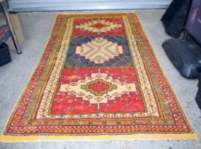 A large yellow ground Turkish rug 265 x 145 cm.