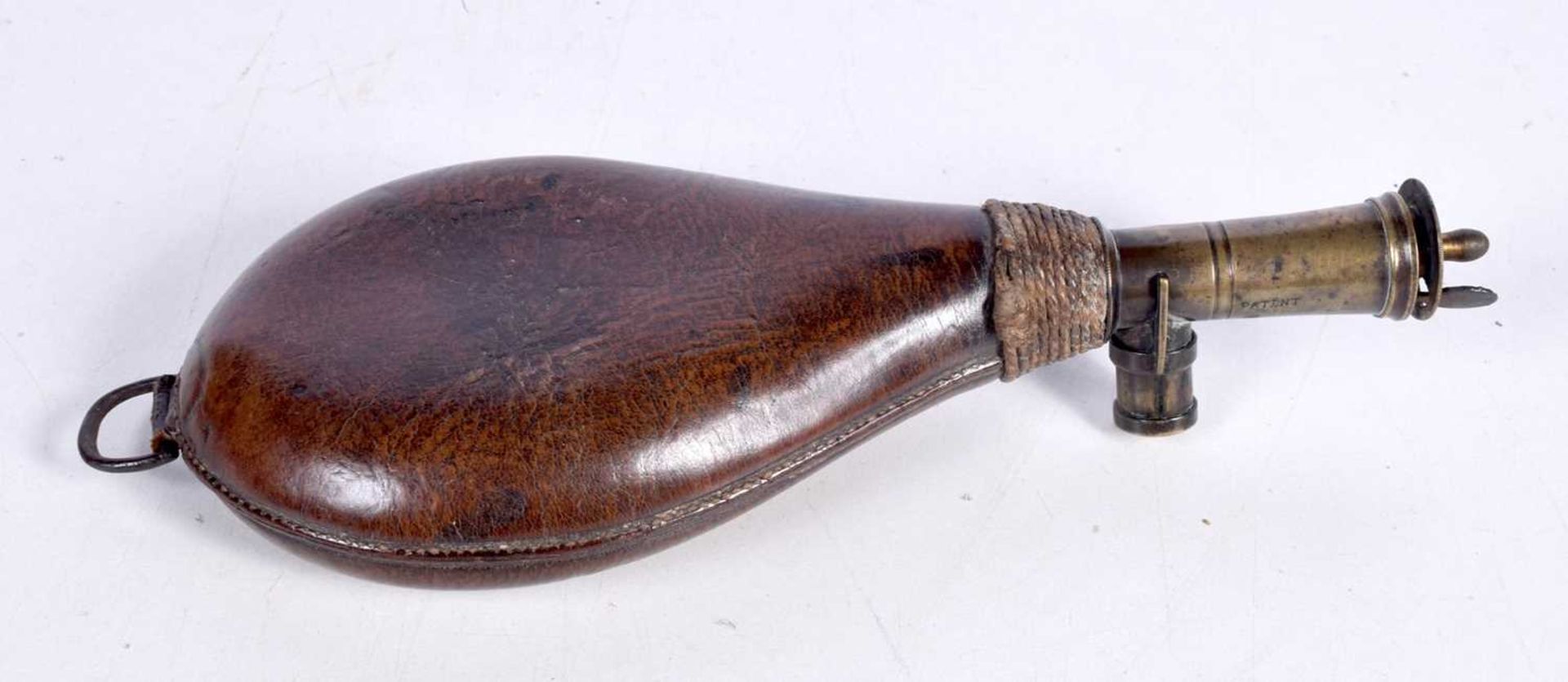 A 19th Century leather and brass powder flask 22cm. - Image 2 of 3