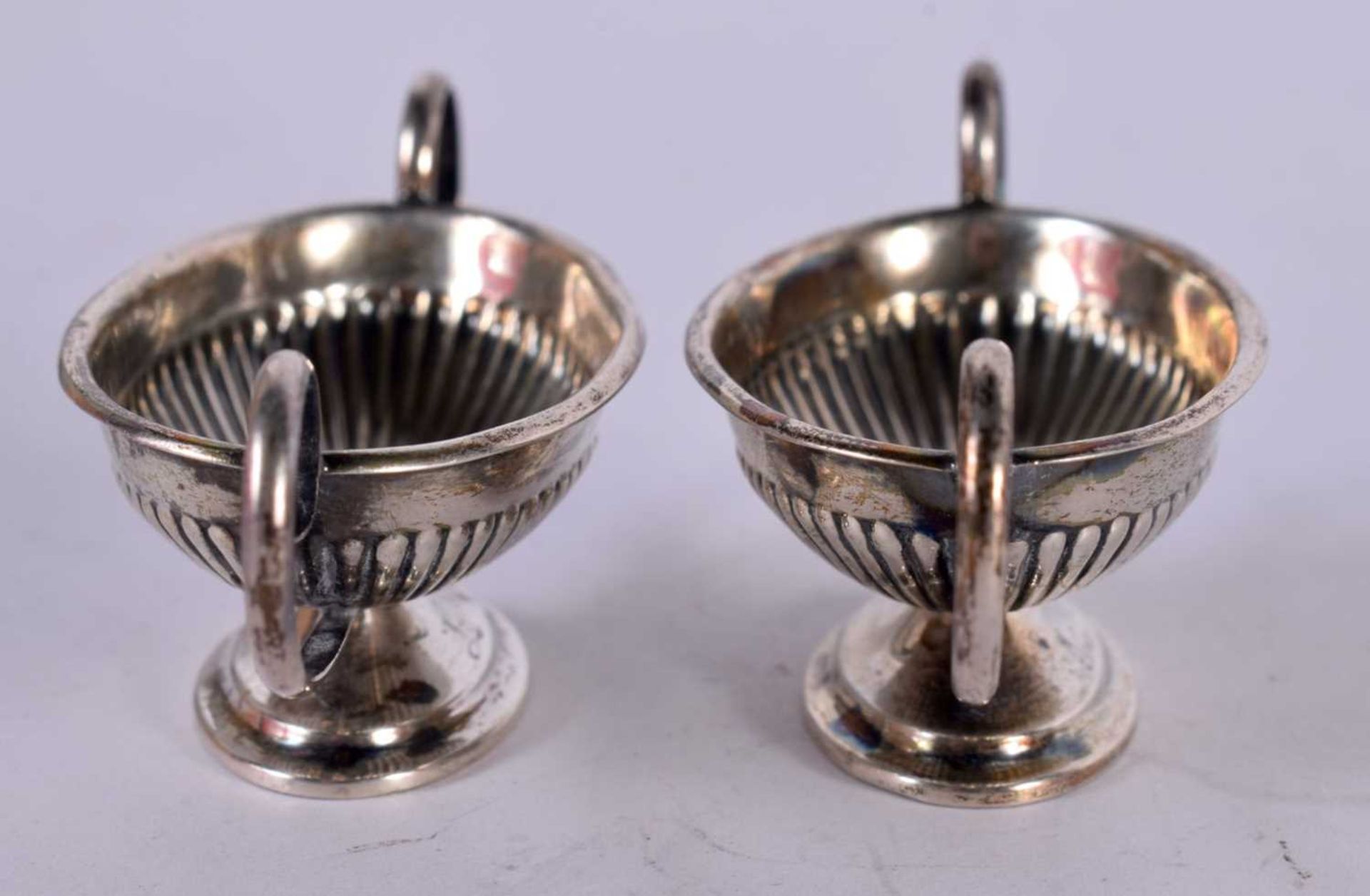 A PAIR OF SILVER CLASSICAL STYLE BOAT SHAPED SALTS. Stamped Sterling, 7.6 cm x 2.6 cm x 3cm, total - Image 2 of 4