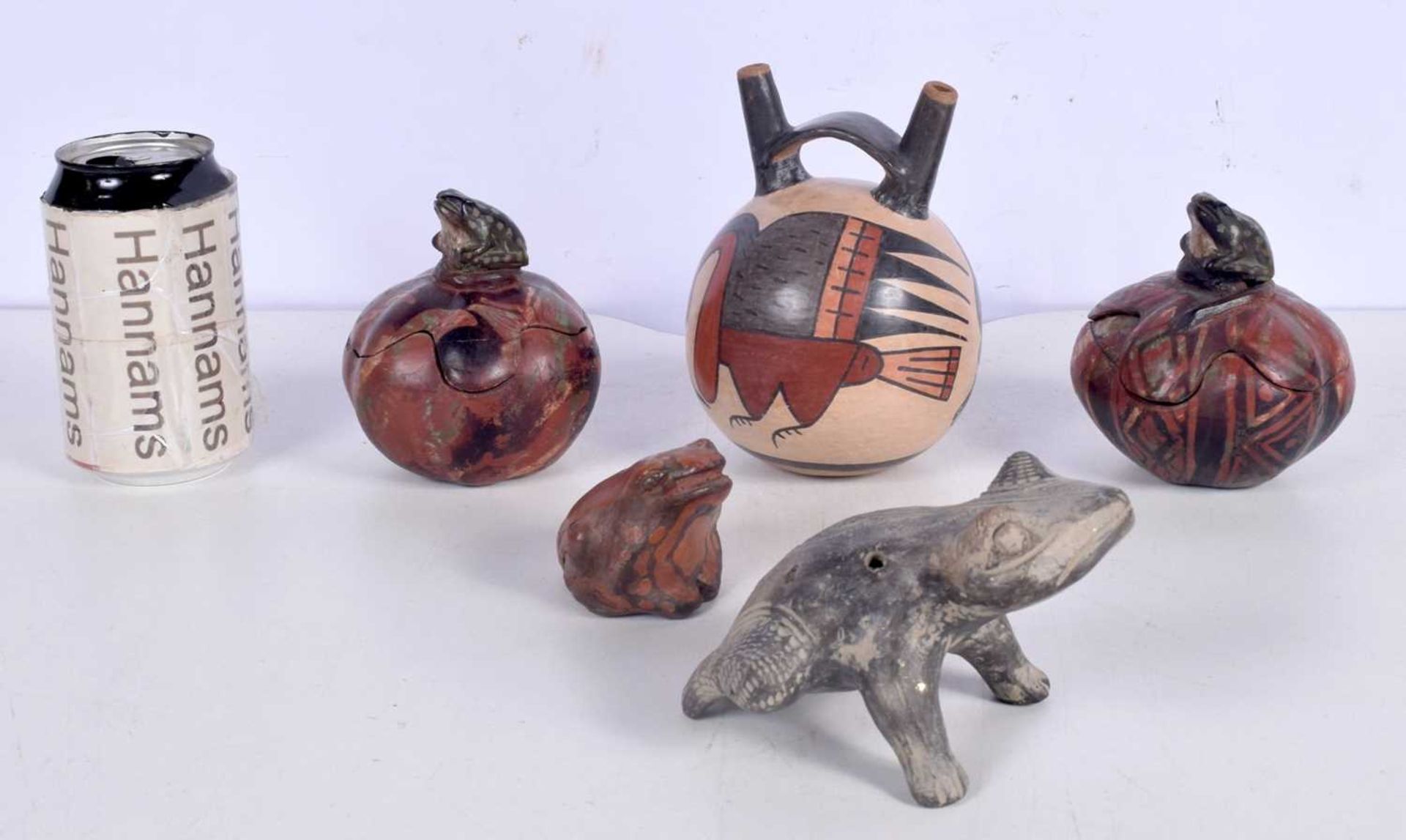 A Peruvian Nasca culture style terracotta vessel together with other Peruvian items , Frog pots