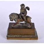 A LOVELY EARLY 19TH CENTURY ENGLISH REGENCY BRONZE INKWELL depicting a winged boy riding upon a