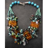 An Amber boulder and multi bead necklace 55 cm