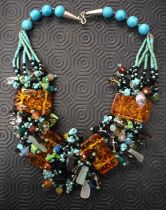 An Amber boulder and multi bead necklace 55 cm