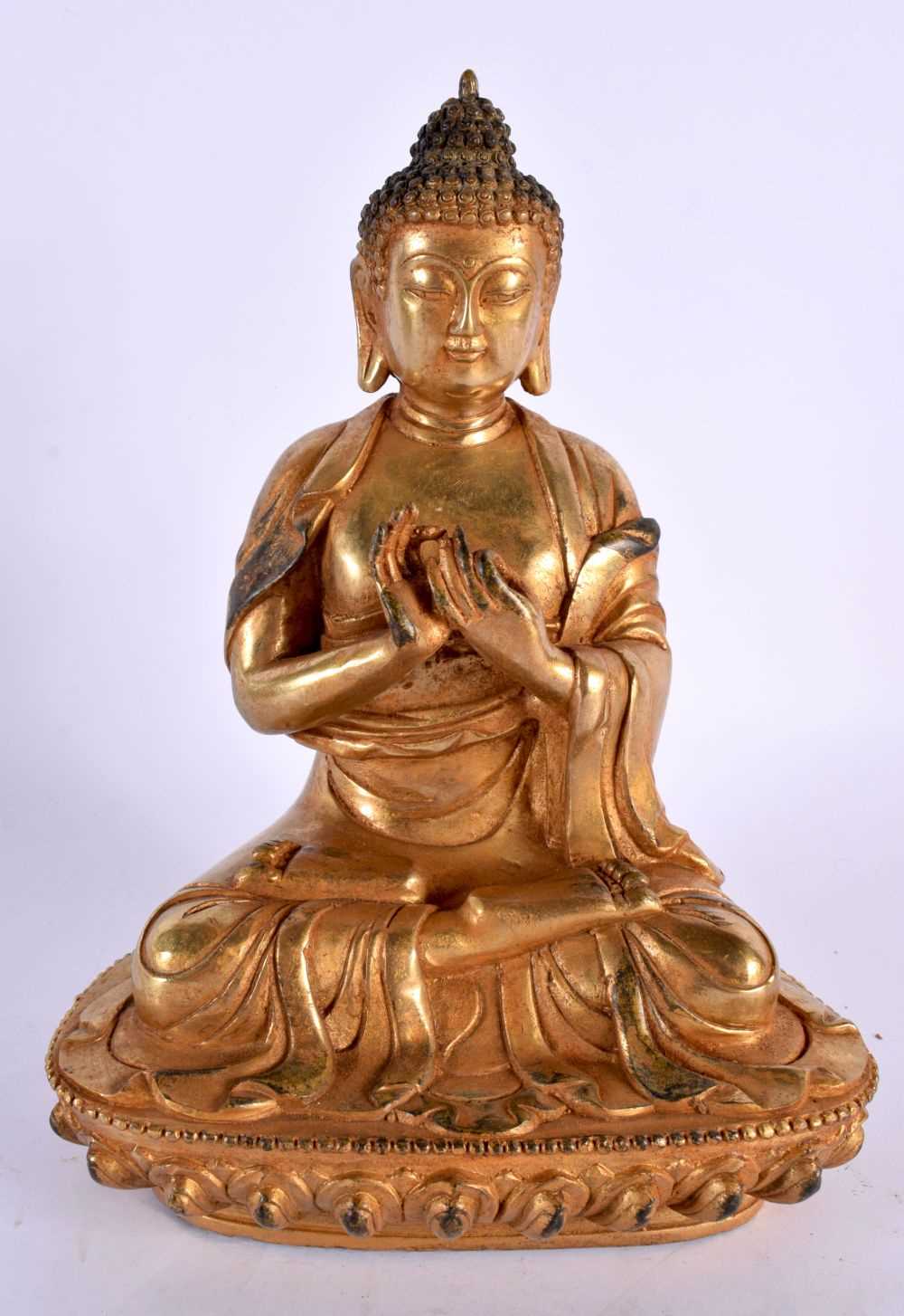 A CHINESE TIBETAN GILT BRONZE FIGURE OF A BUDDHA 20th Century. 22cm x 12 cm.