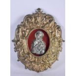 A EUROPEAN YELLOW AND WHITE METAL FRAMED RELIQUARY possibly silver gilt, depicting a Madonna and