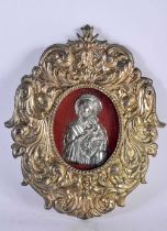 A EUROPEAN YELLOW AND WHITE METAL FRAMED RELIQUARY possibly silver gilt, depicting a Madonna and