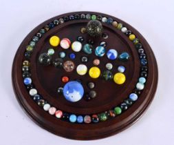 A SOLITAIRE MARBLE BOARD with marbles. 32 cm diameter. (qty)