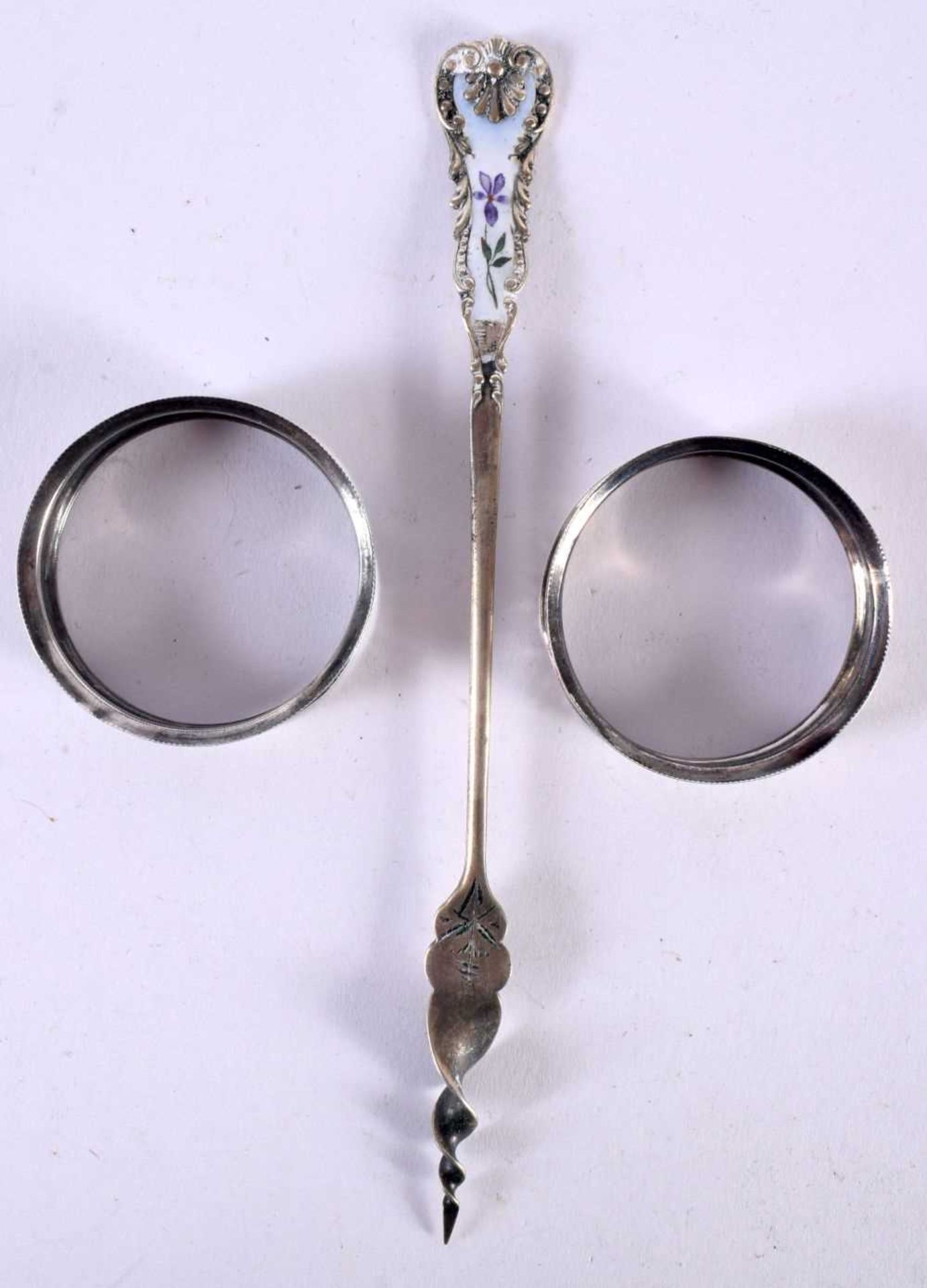 A PAIR OF VICTORIAN SILVER NAPKIN RINGS AND A SILVER AND ENAMEL SWIZZLE STICK. Rings Hallmarked