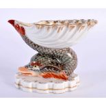 AN 18TH/19TH CENTURY GERMAN PORCELAIN DOLPHIN SHELL SALT Berlin or Meissen, painted with fowl within