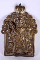 A 17TH/18TH CENTURY INDIAN BRONZE BUDDHISTIC VOTIVE SHRINE PANEL depicting a deity and two consorts.