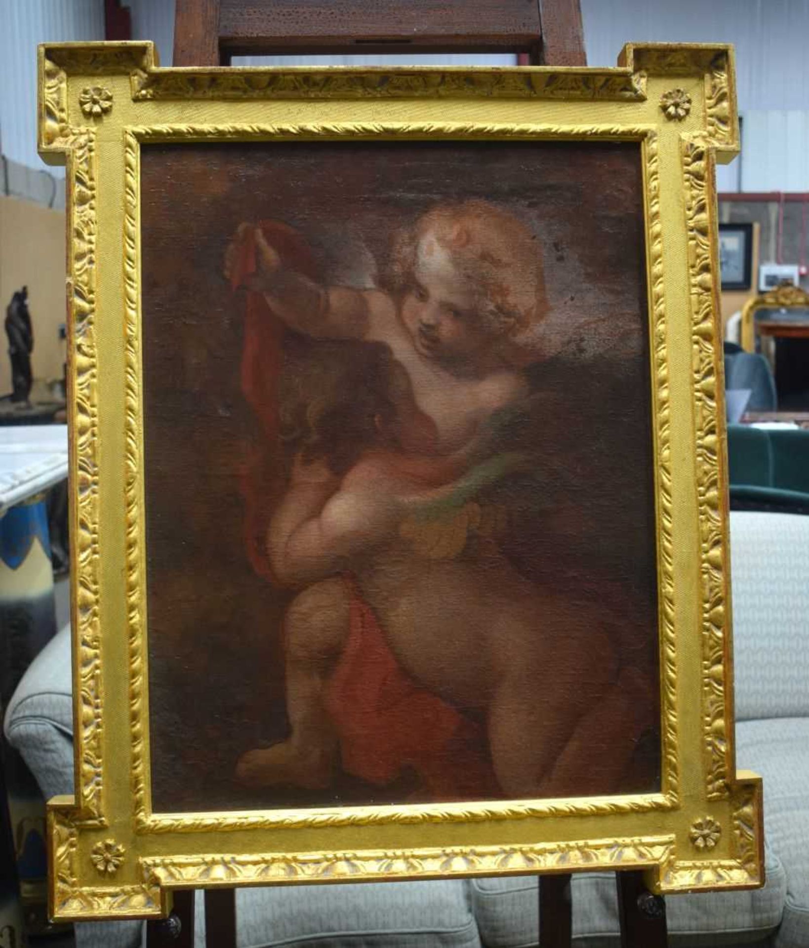 A framed oil on canvas of a Cherub 65 x 50 cm