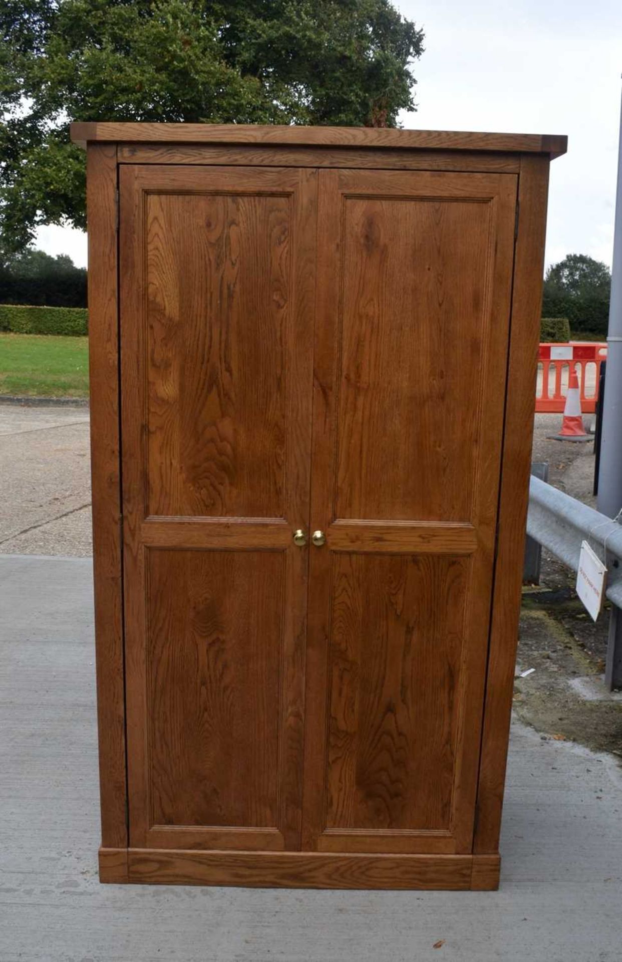 An oak wardrobe 193 x 107 x 56cm.