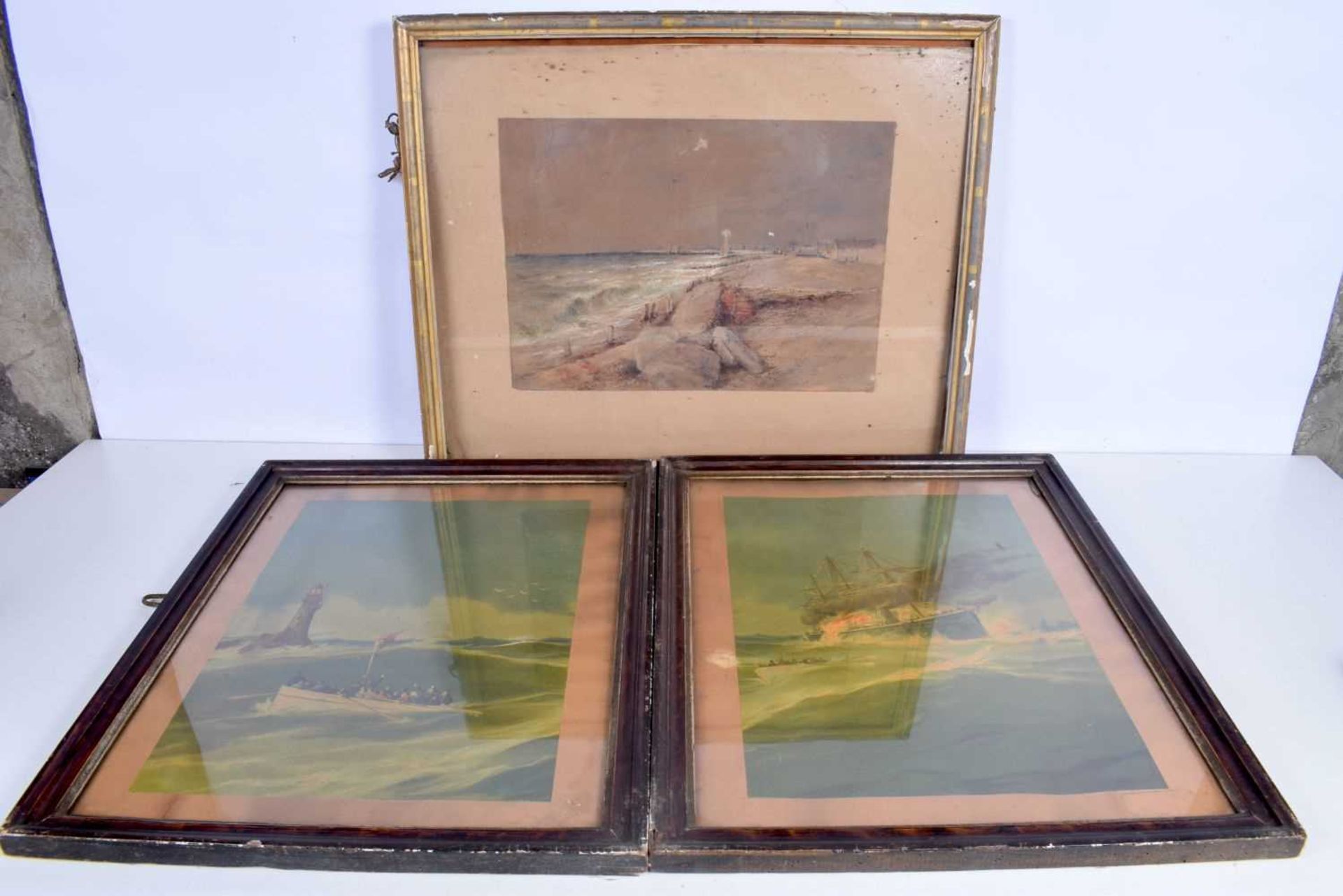 A pair of framed oil on boards depicting a disaster at sea together with a framed watercolour