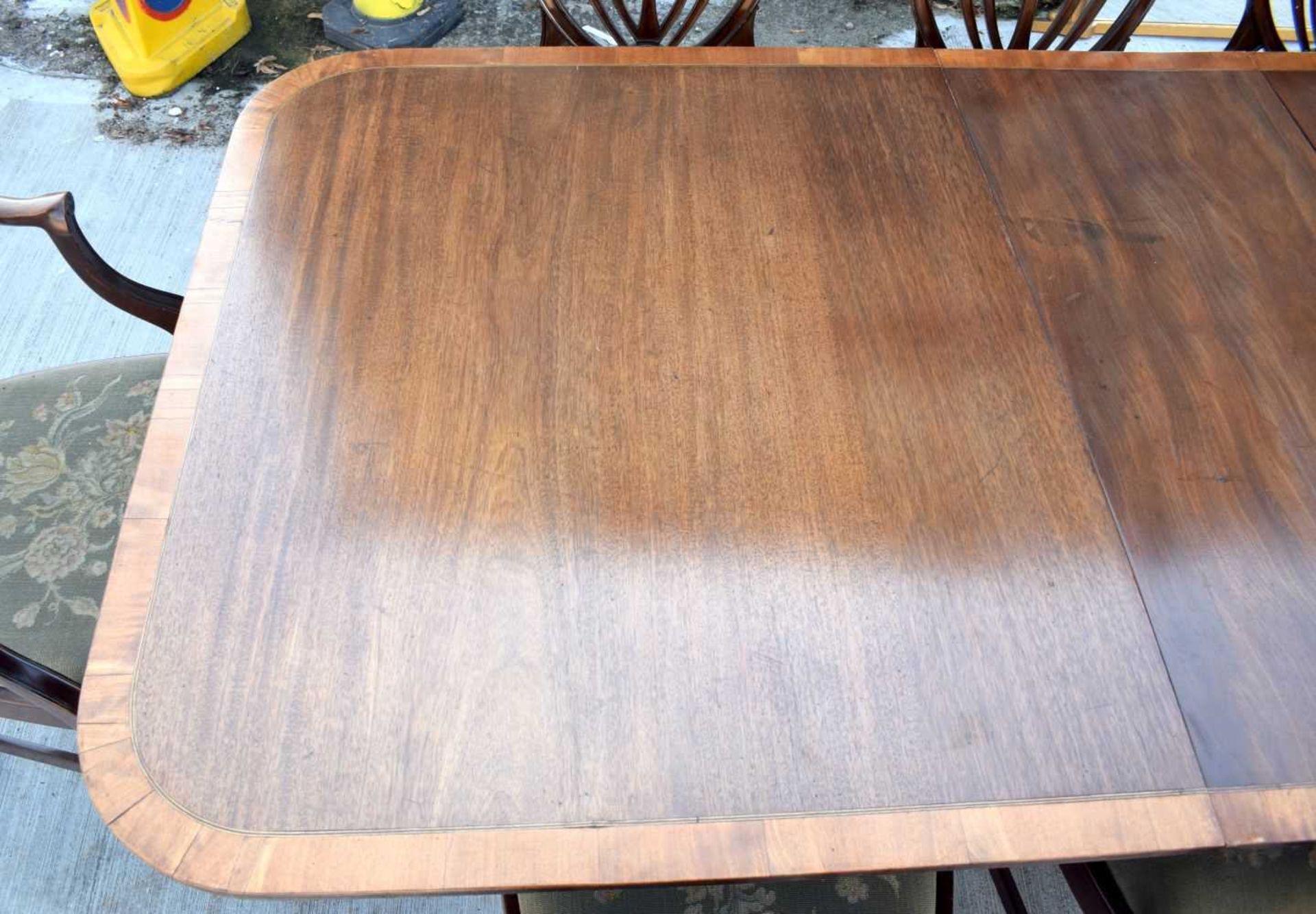 A Mahogany dining table with a veneer edging with 8 mahogany Shield back chairs with upholstered - Image 2 of 12