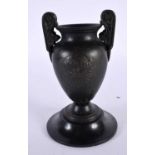 A 19TH CENTURY EUROPEAN TWIN HANDLED GRAND TOUR BRONZE URN After the Antiquity, decorated with