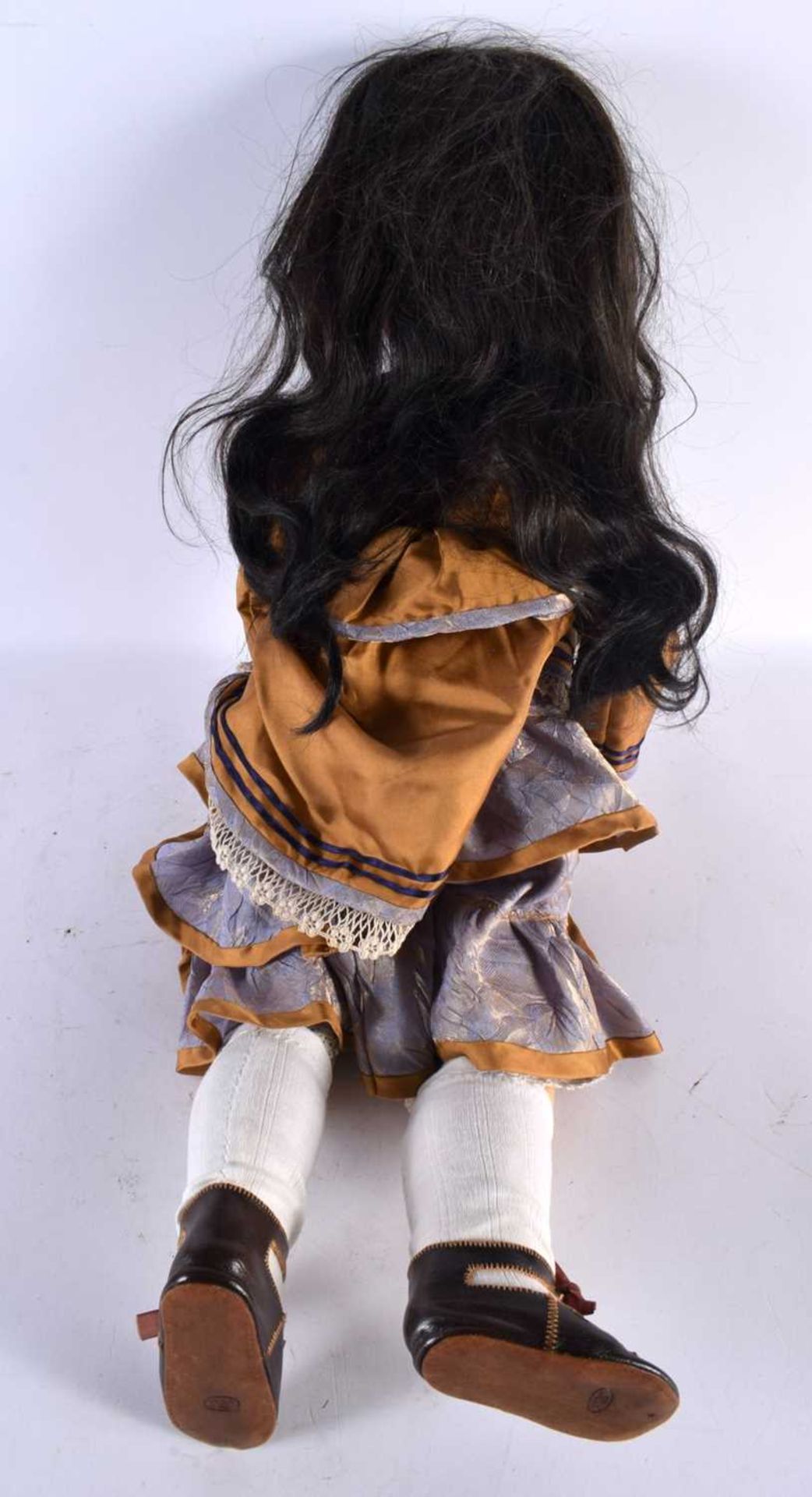 A FINE SIMON HALBIG BISQUE HEADED PORCELAIN DOLL wearing original mustard clothing. 65 cm long. - Image 6 of 6