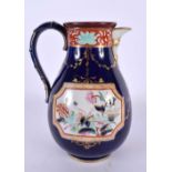 A RARE ANTIQUE MASONS IRONSTONE HOT WATER JUG printed and painted with flowers upon a rich blue