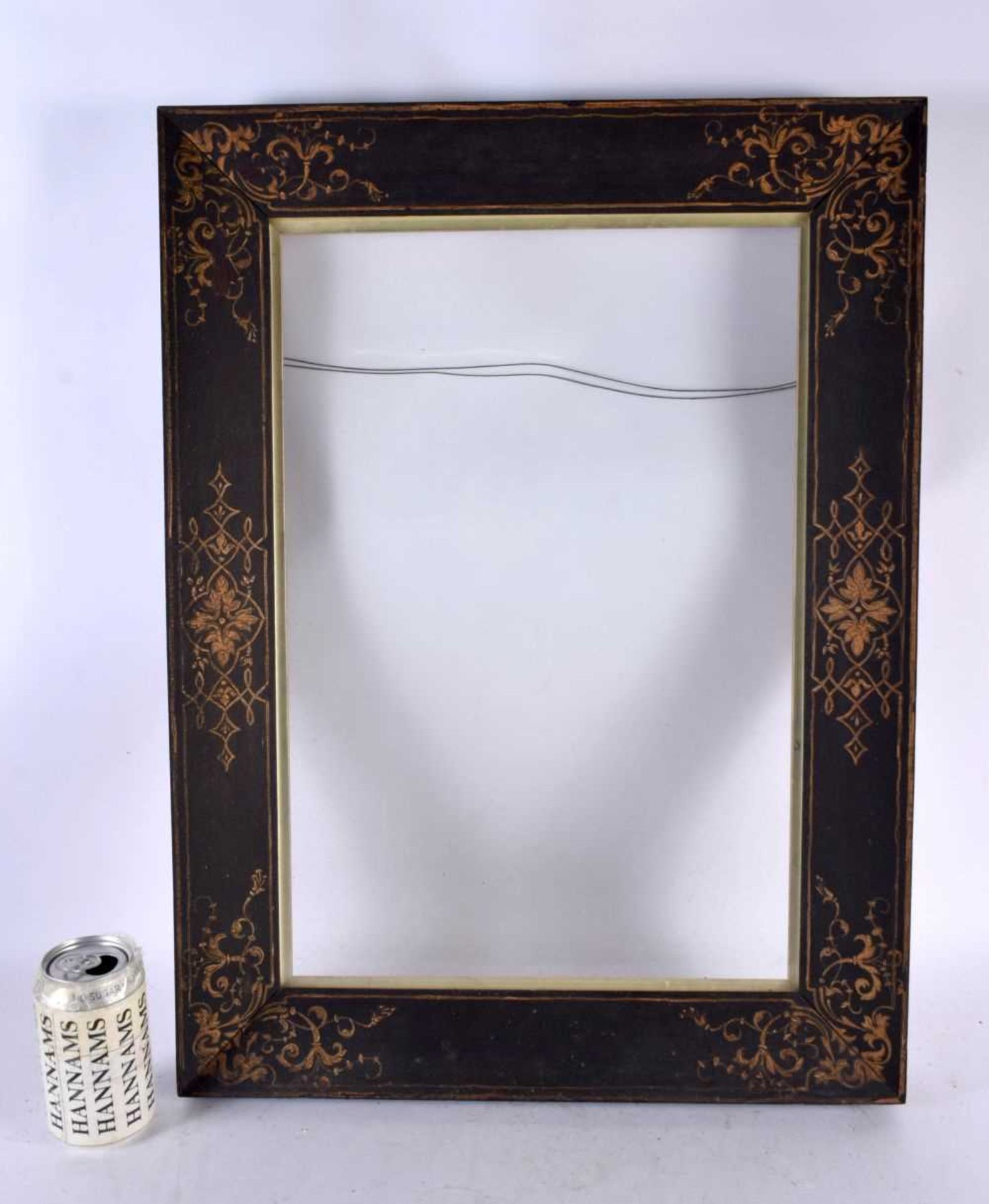 AN EARLY 19TH CENTURY PAINTED AND LACQUERED ROSEWOOD PICTURE FRAME decorated with pen work flowers