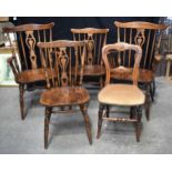 A collection of antique Oak Windsor armchairs together with three other smaller wooden chairs
