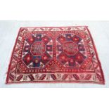 An Oriental rug 137 x 163 cm.