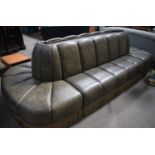 A large Oval Faux leather inter connecting Gallery Sofas with a central wooden panelled insert