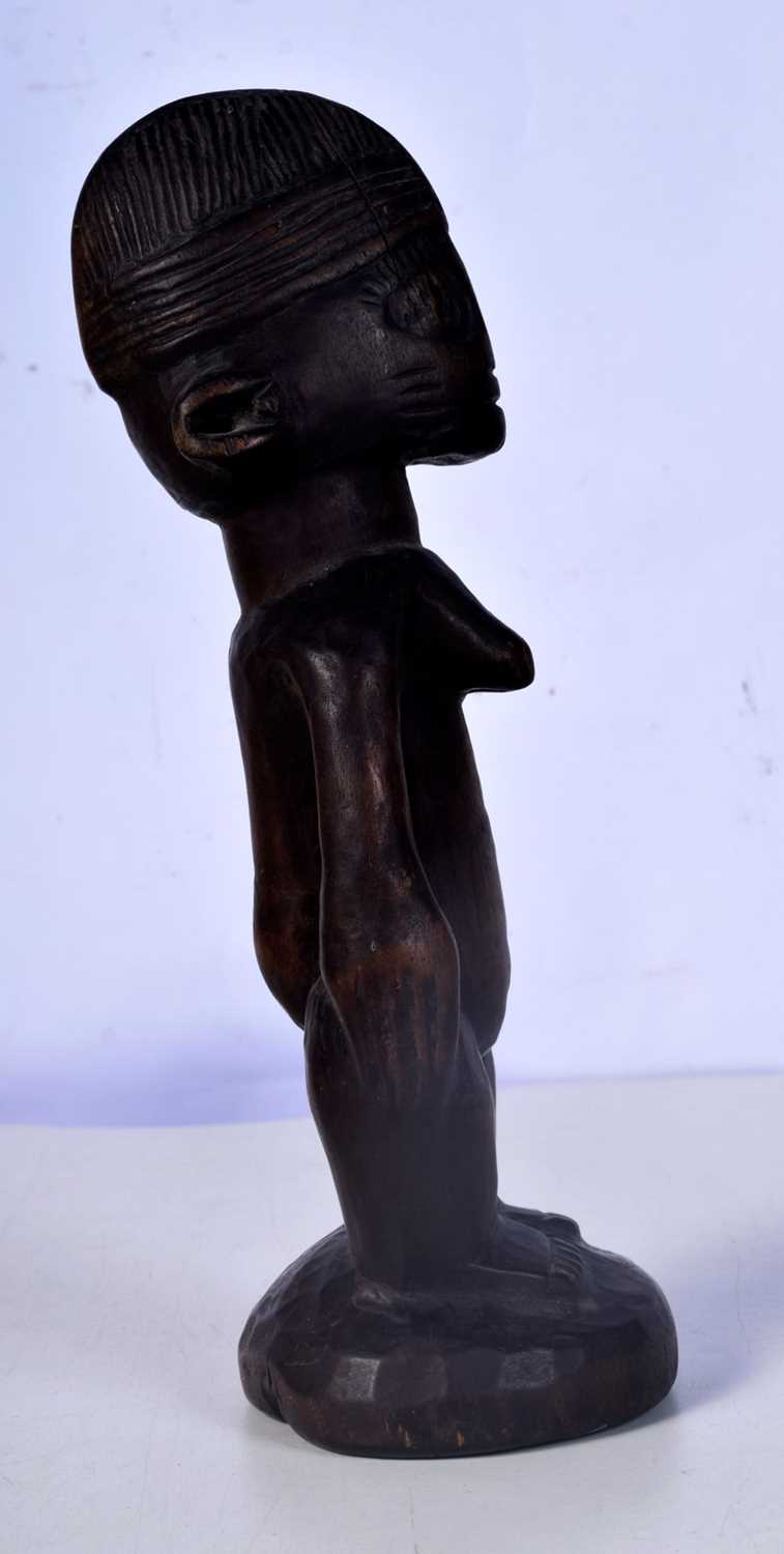 A carved wood Nigerian Yoruba female Ibeji figure 24 cm. - Image 2 of 5