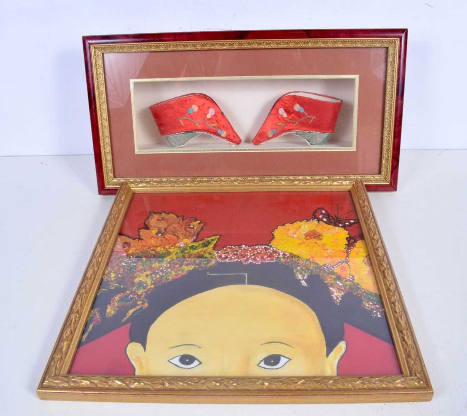 A framed pair of Chinese slippers together with a framed oil on board of a Chinese child and a large