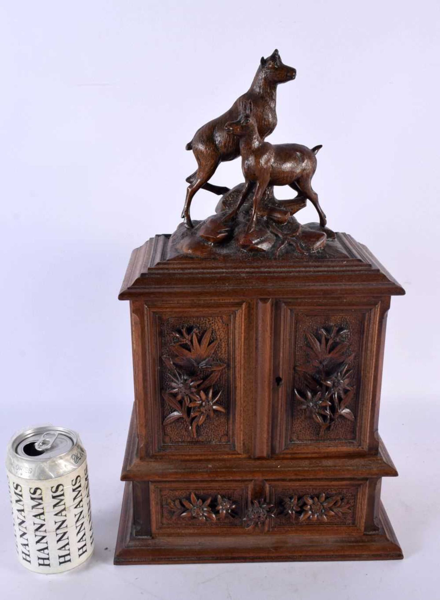A LARGE 19TH CENTURY BAVARIAN BLACK FOREST CARVED WOOD JEWELLERY CABINET formed with two ibex. 40 cm