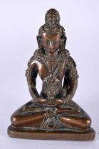A GOOD 18TH CENTURY TIBETAN NEPALESE BRONZE FIGURE OF A SEATED BUDDHA modelled holding a stupa, upon