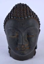 AN 18TH/19TH CENTURY CHINESE TIBETAN CARVED STONE HEAD OF A BUDDHA sureenly modelled with eyes