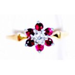 AN 18CT GOLD DIAMOND AND RUBY RING. 2.3 grams. N.