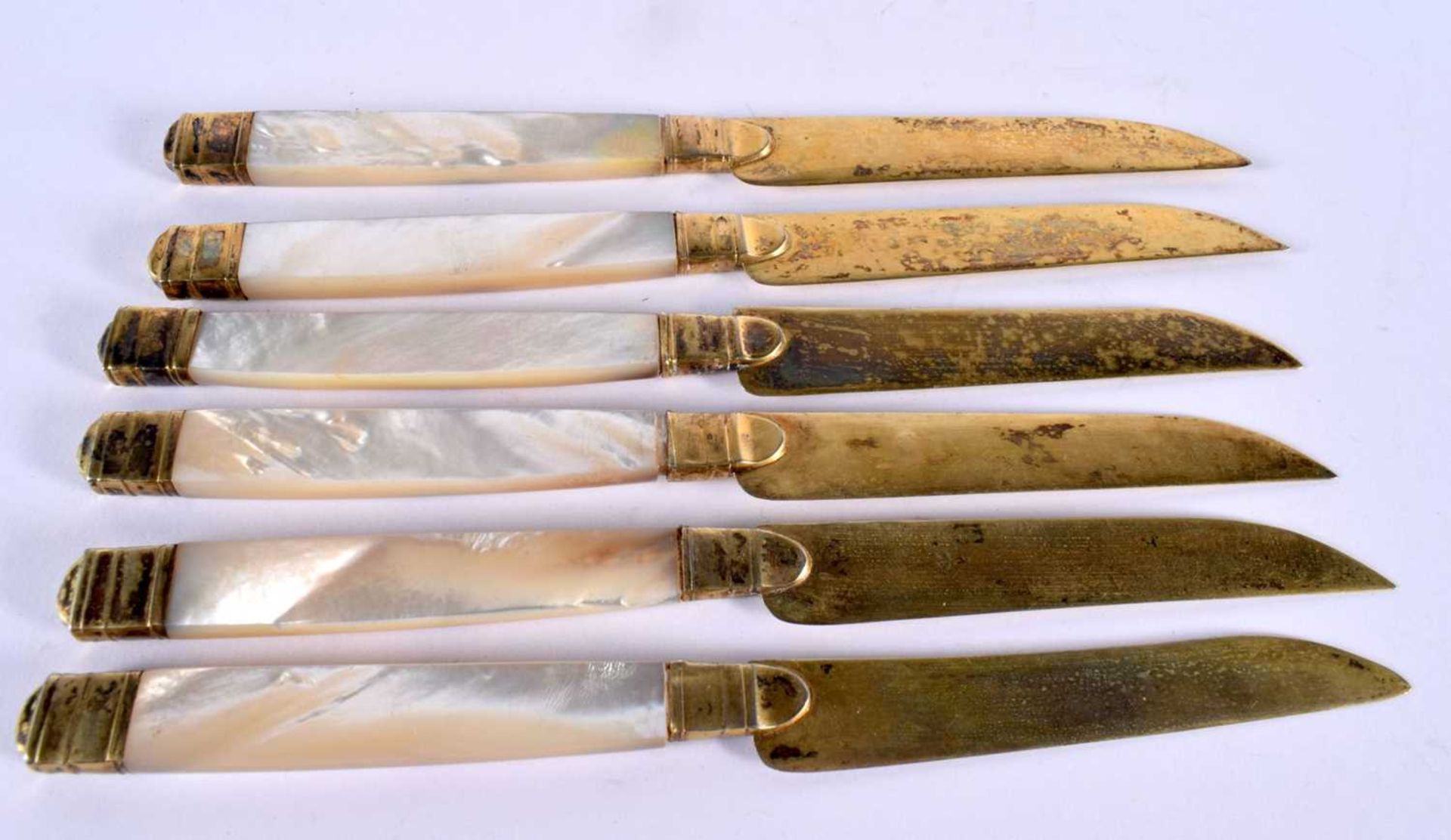 A SET OF SIX ANTIQUE SILVER GILT AND MOTHER OF PEARL KNIVES. 203 grams. 20cm long. (6) - Image 2 of 3