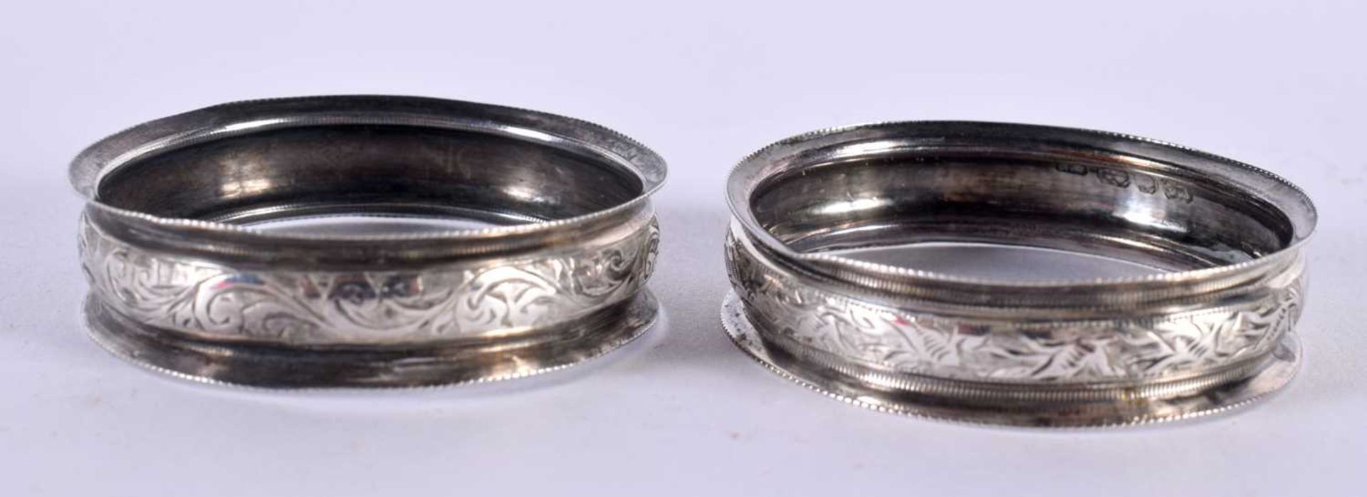 A PAIR OF VICTORIAN SILVER NAPKIN RINGS AND A SILVER AND ENAMEL SWIZZLE STICK. Rings Hallmarked - Image 2 of 3