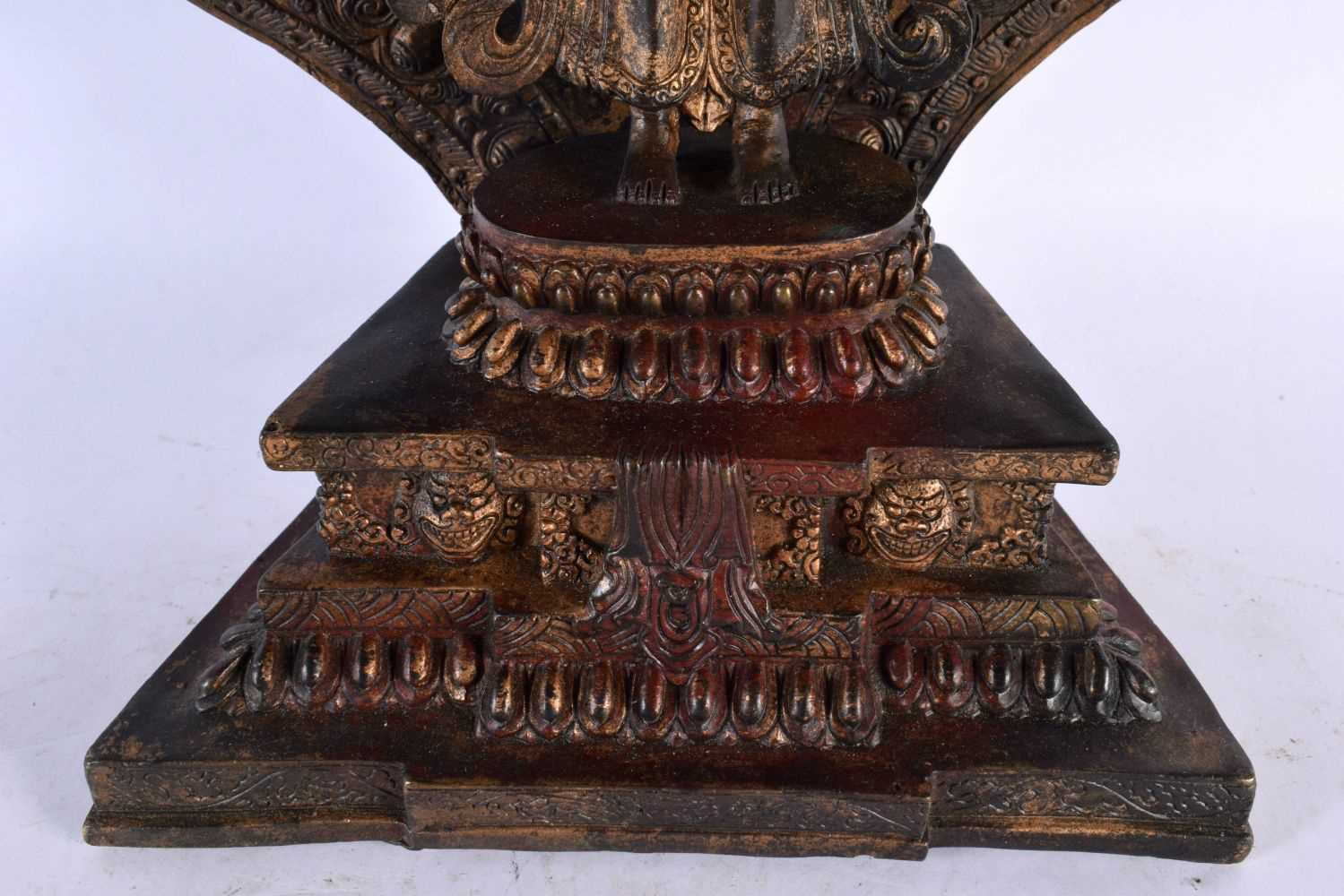 A LARGE CHINESE LACQUERED SINO TIBETAN BRONZE FIGURE OF A BUDDHA modelled with multiple arms. 46 - Image 6 of 10