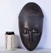 An Ivory Coast carved wood Guro Tribal mask 33 cm.