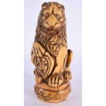 AN UNUSUAL 18TH CENTURY FRENCH SALT GLAZED POTTERY FIGURE OF A LION modelled holding a fleur de