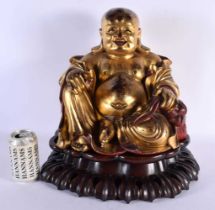 A VERY LARGE EARLY 20TH CENTURY CHINESE CARVED AND LACQUERED GILTWOOD BUDDHA Late Qing/Republic, the