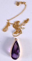 A GOLD MOUNTED AMETHYST NECKLACE. 8.1 grams. Pendant 2.75 cm x 1.25 cm.